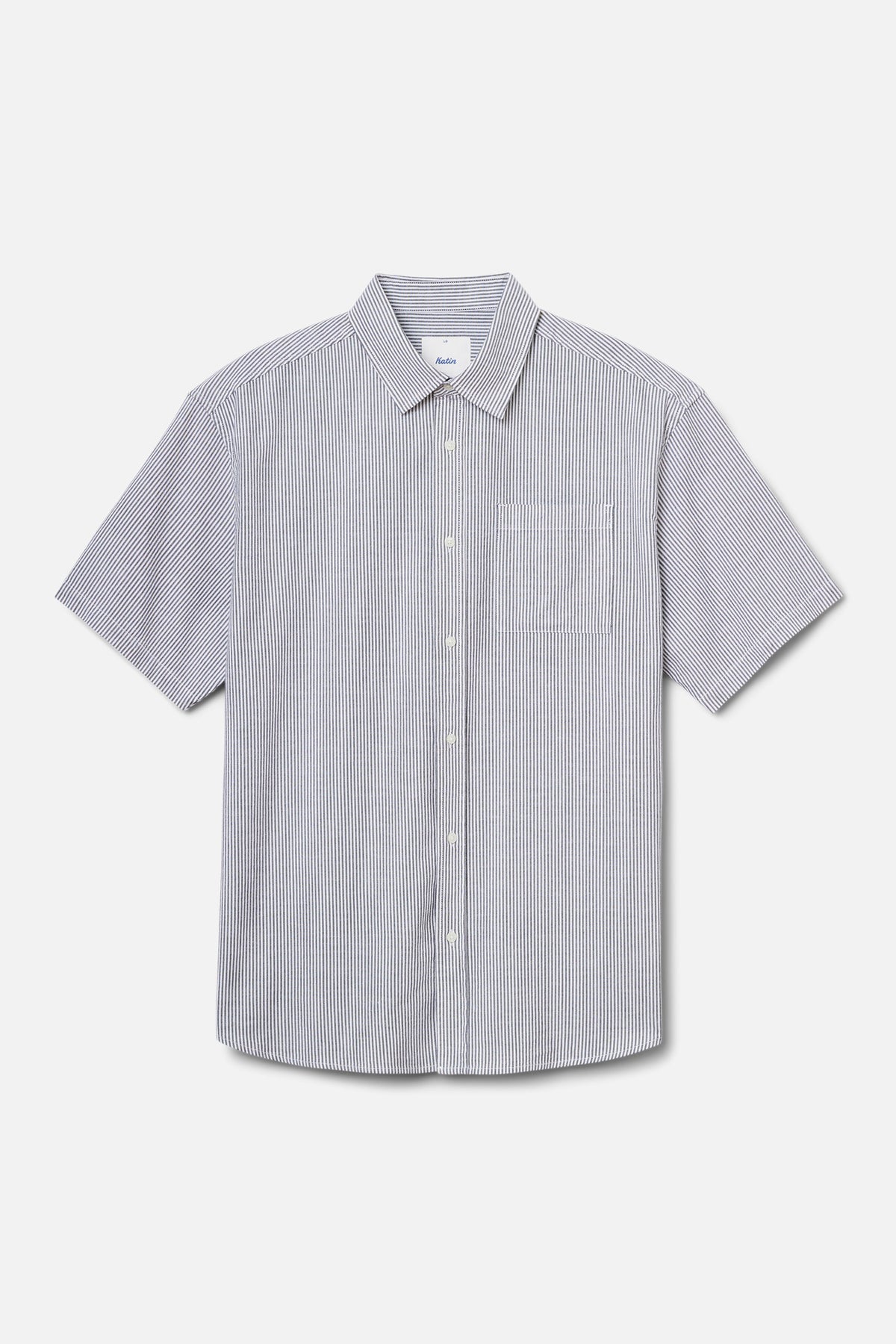 Short-sleeve shirt with a subtle pattern on a light gray background