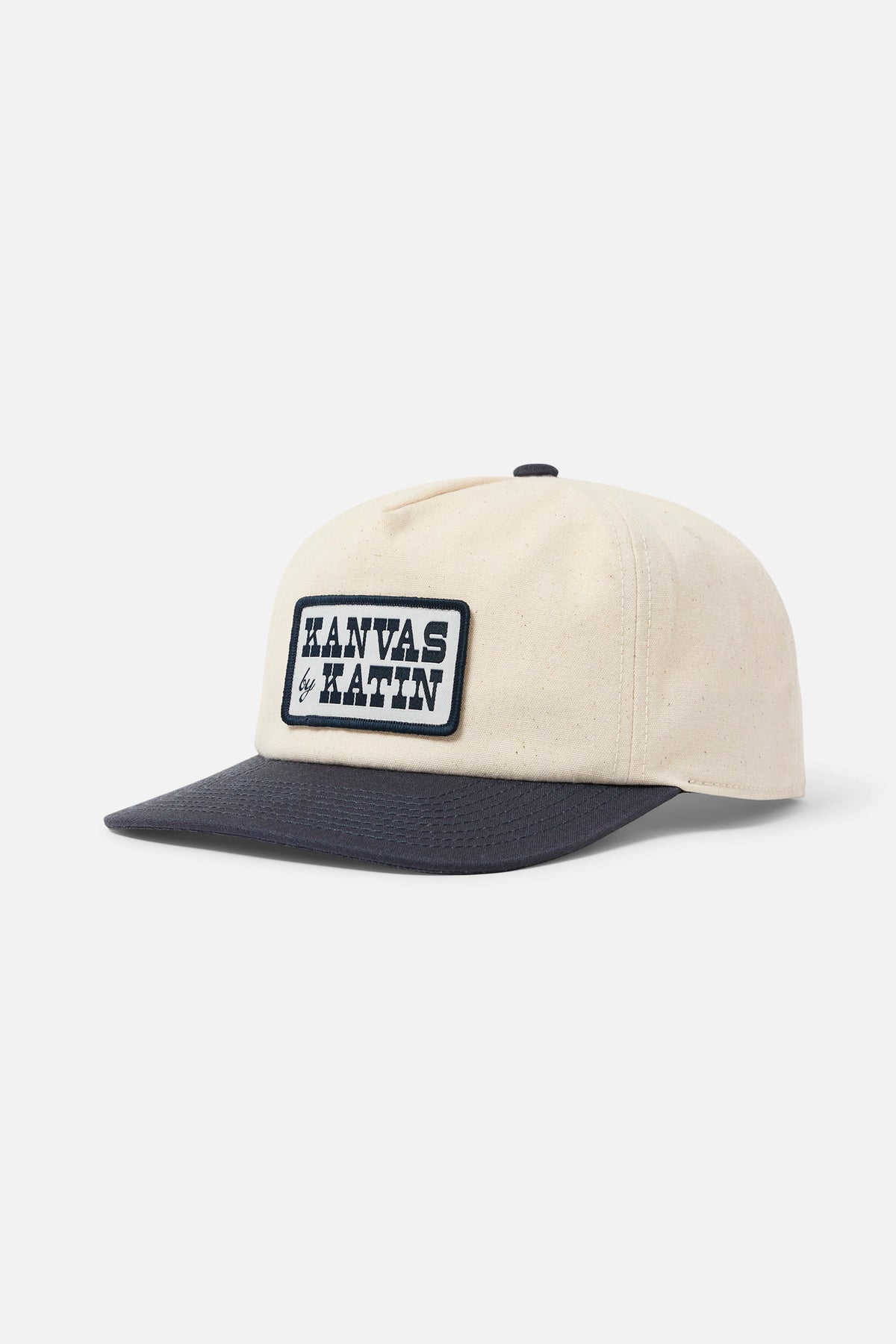 Beige and navy cap with a logo on a white background