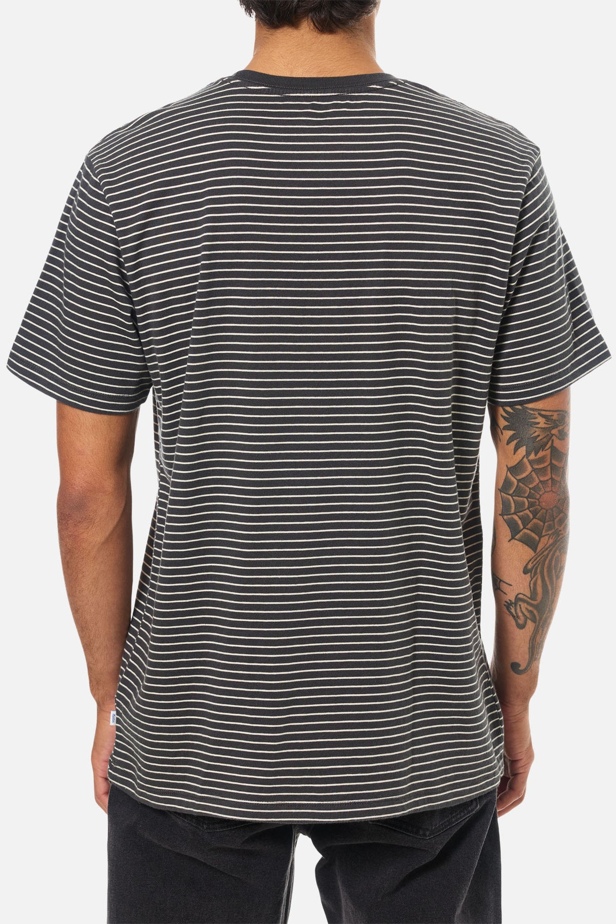 Person wearing a black and white striped t-shirt on a white background