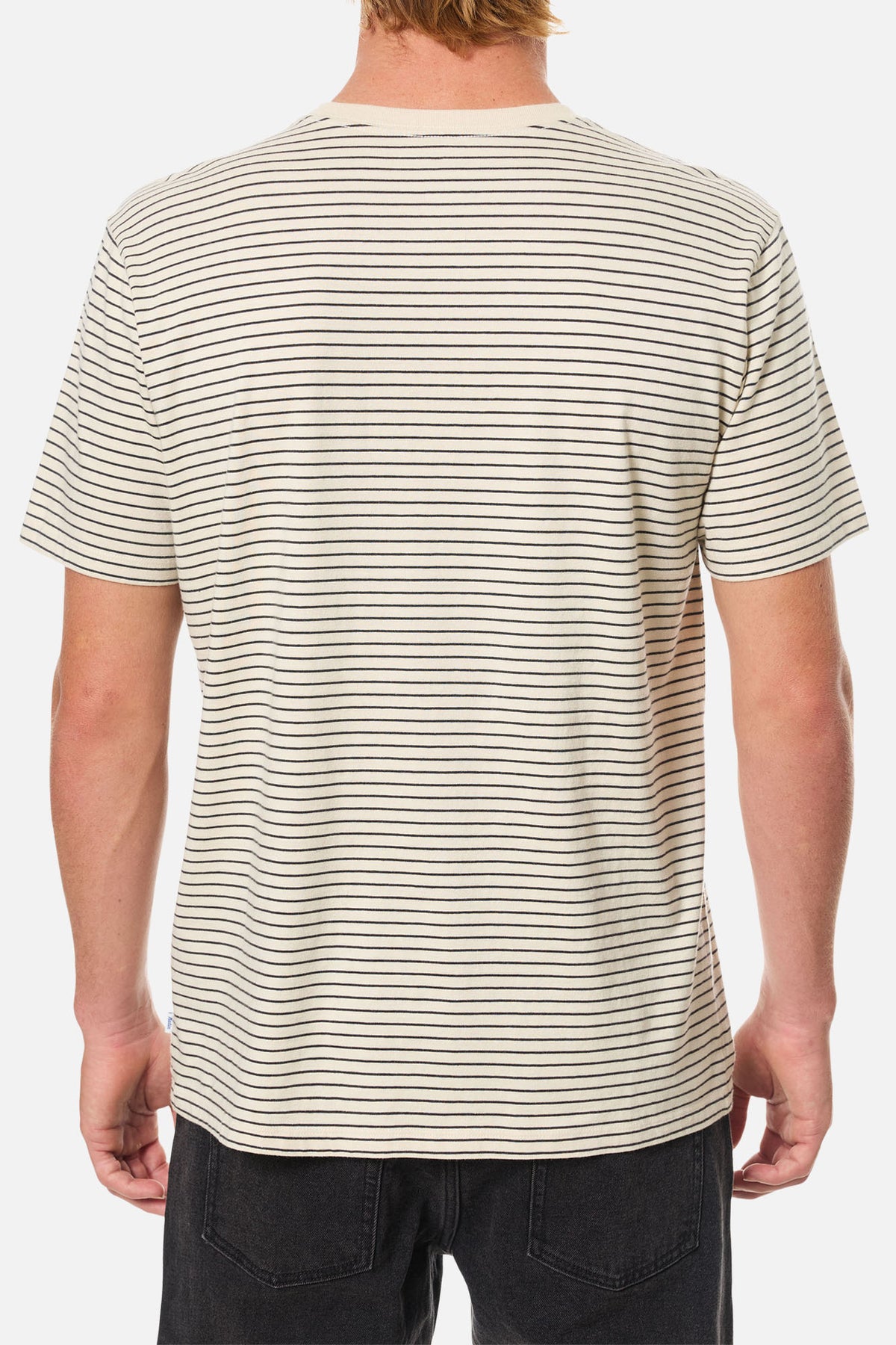 Person wearing a striped t-shirt with a plain background