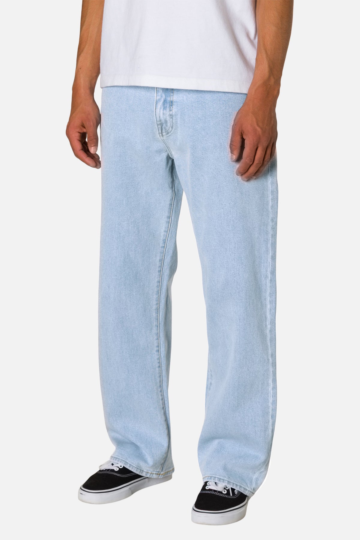 Light blue jeans worn by a person on a white background