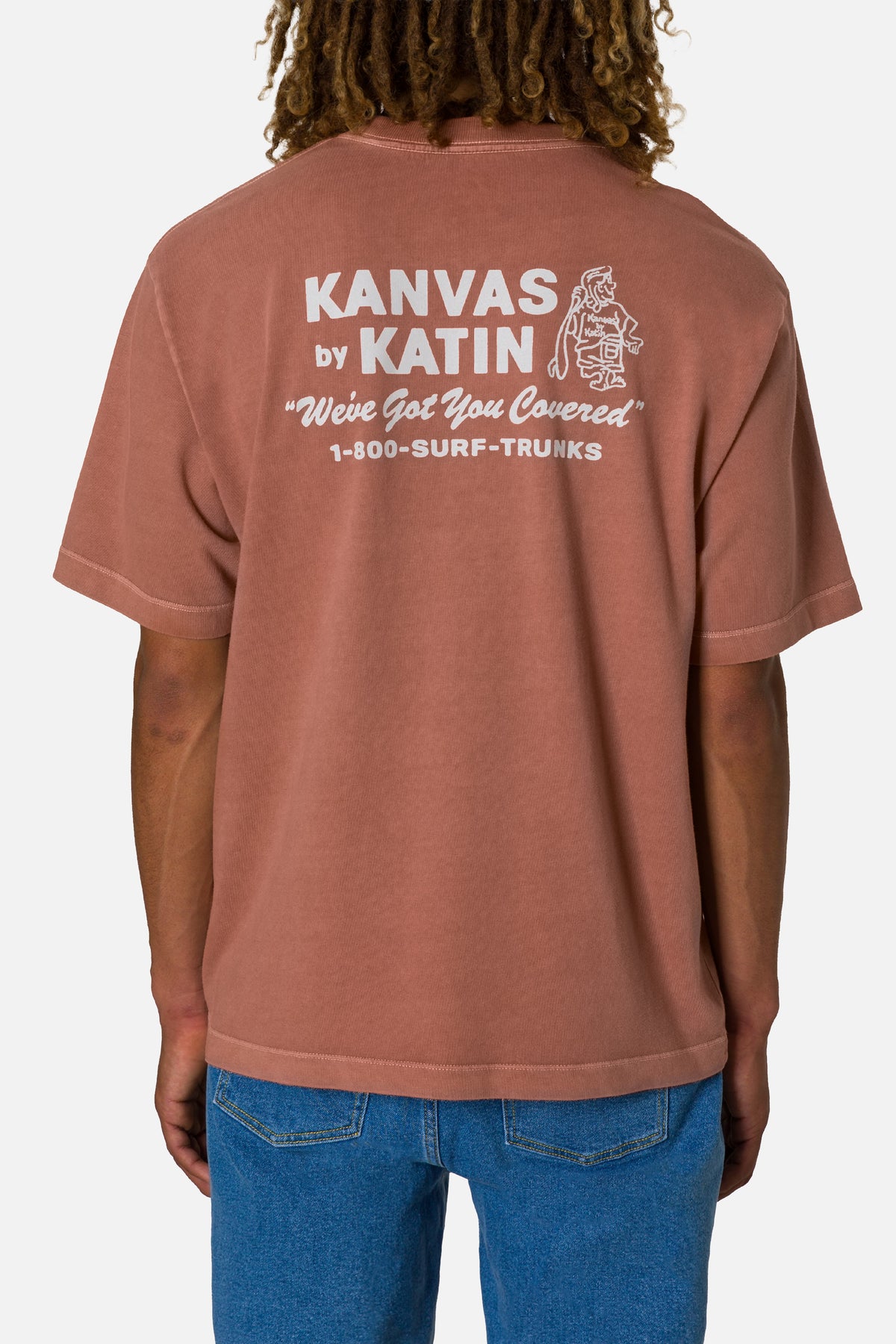 Person wearing a brown t-shirt with 'Kanvas by Katin' branding on the back.