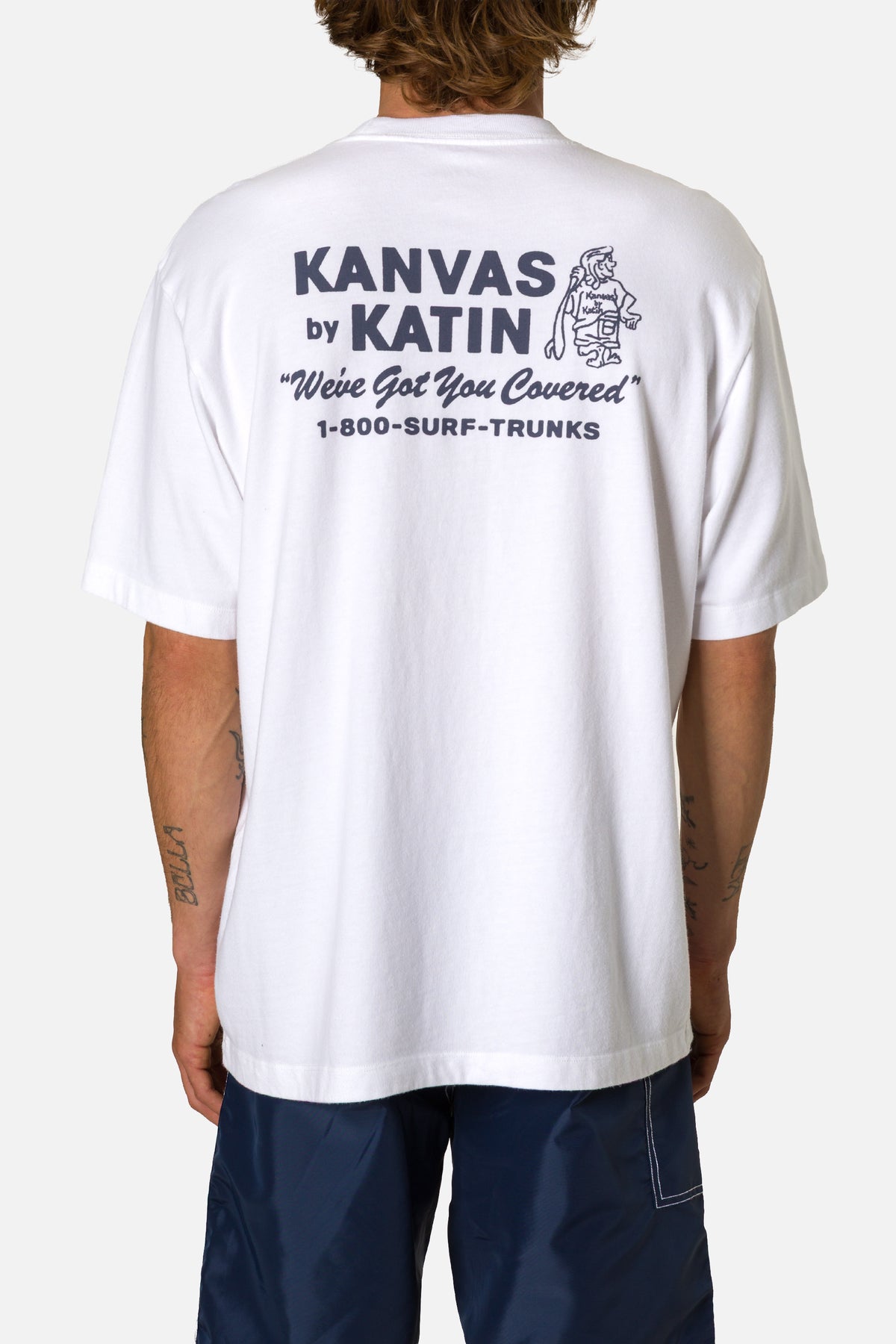 Person wearing a white t-shirt with Kanvas by Katin branding on the back.