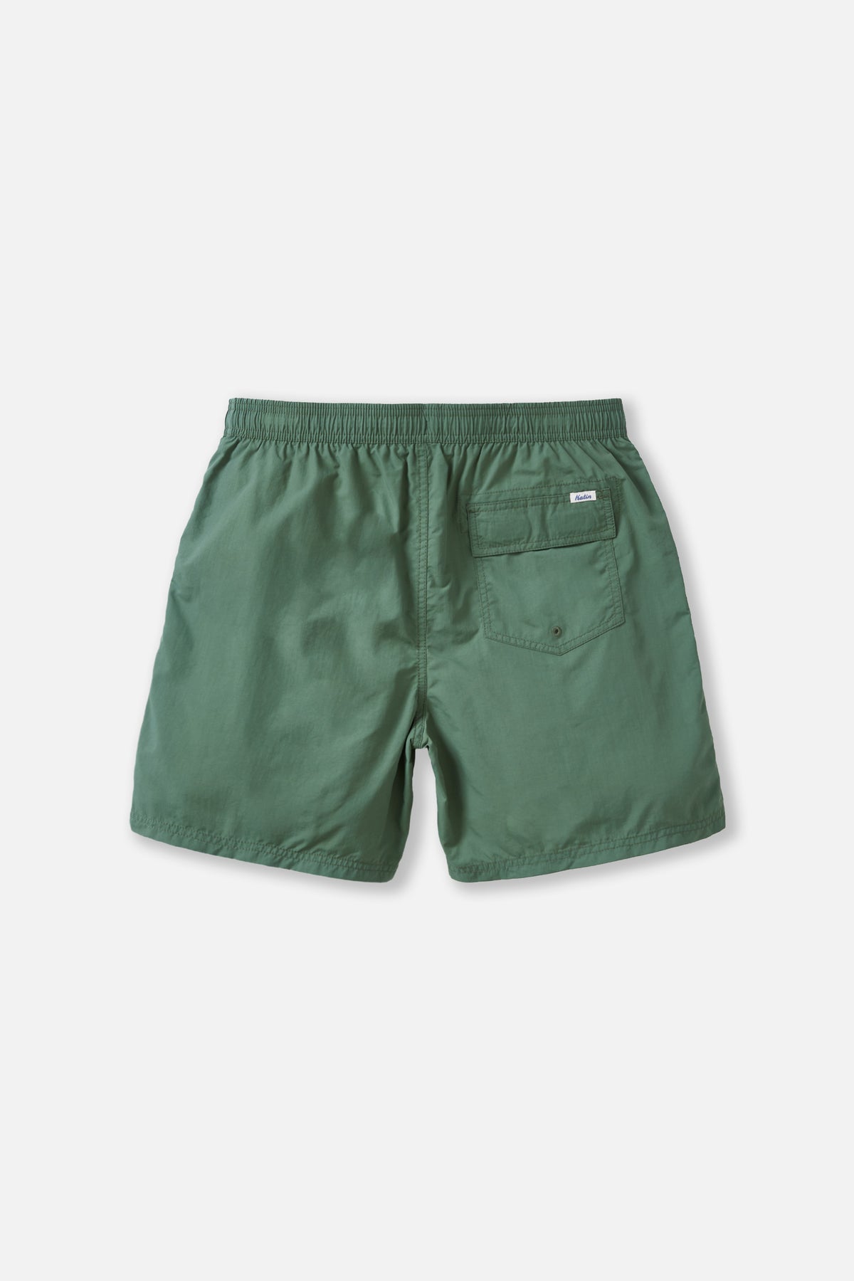 Green shorts on a light gray background