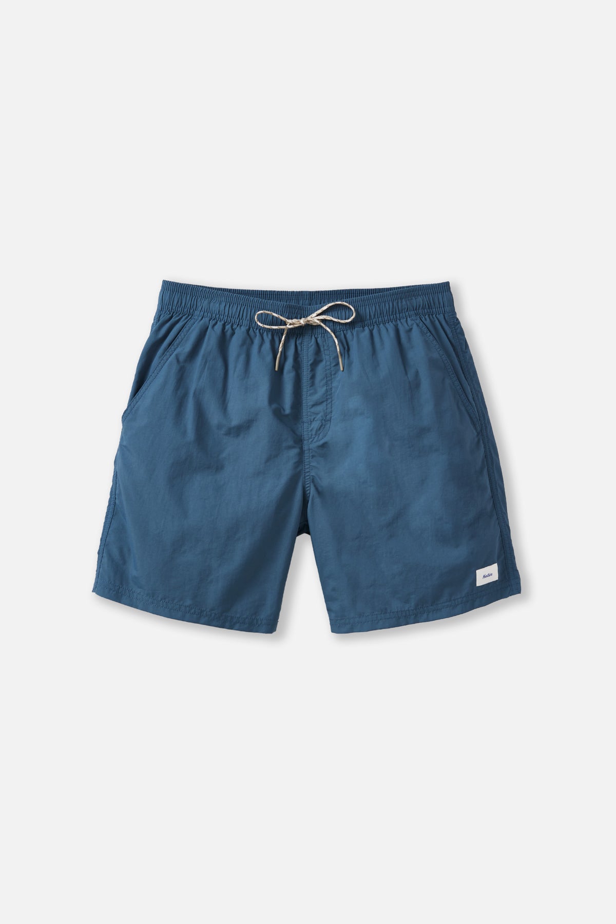 Blue shorts with a drawstring on a light gray background