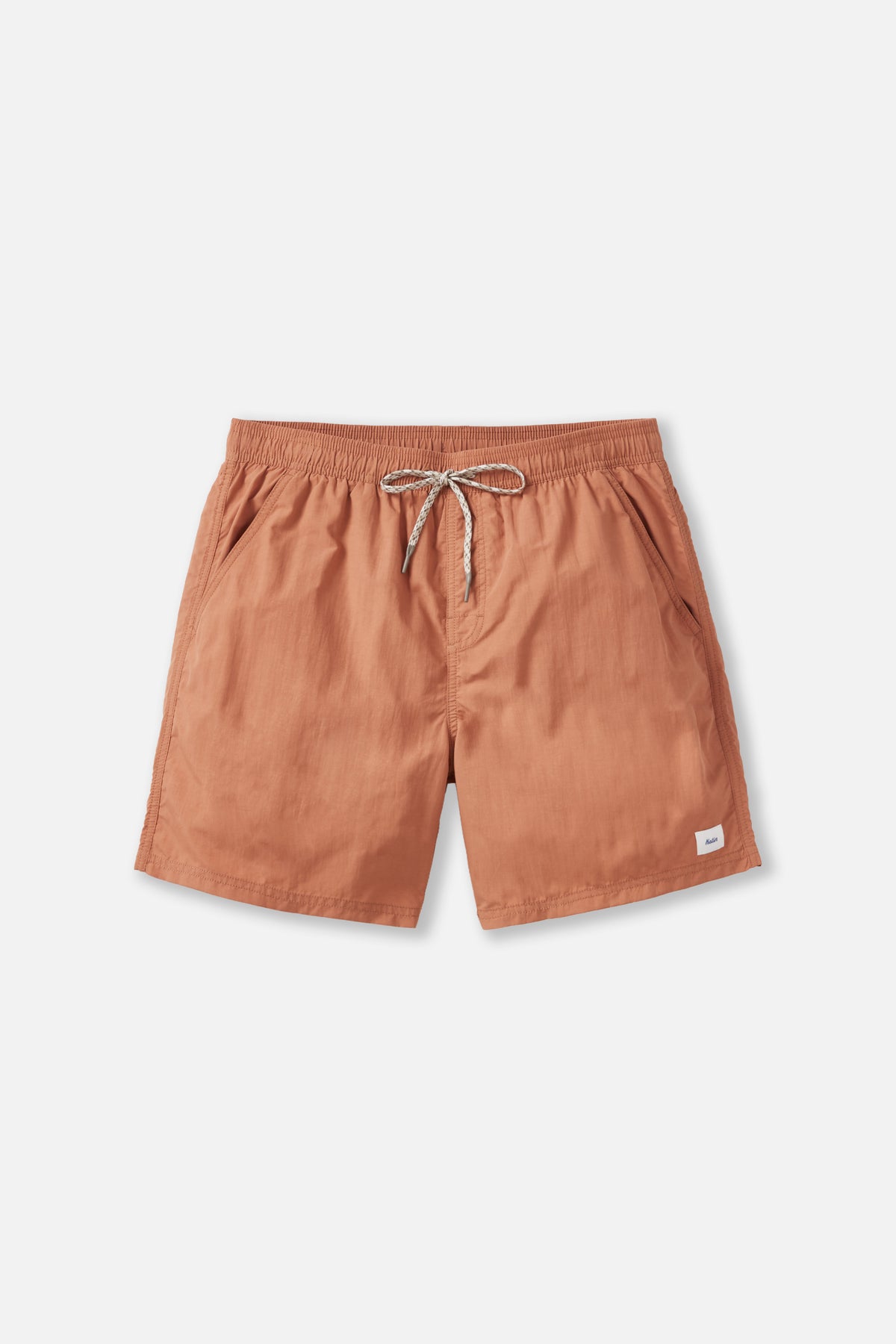 Orange shorts with a drawstring on a white background