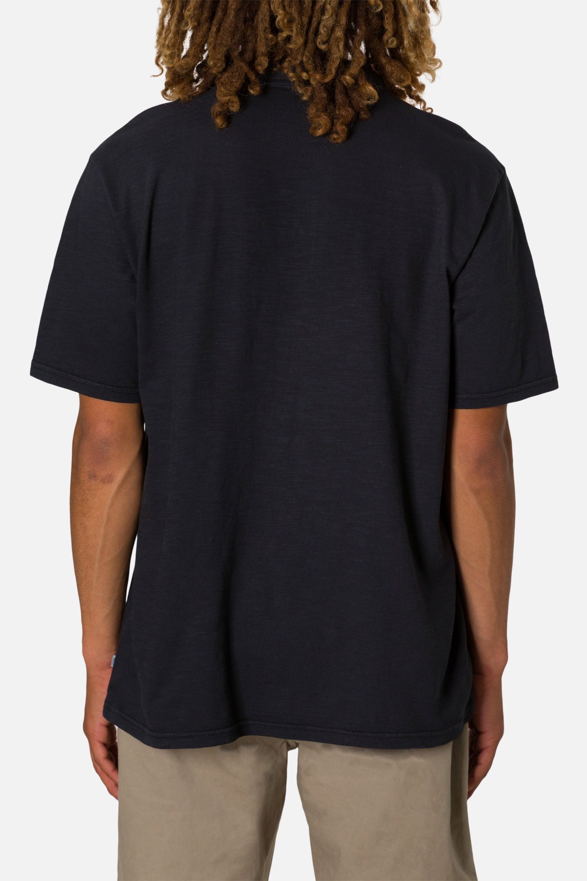 Person wearing a black t-shirt on a white background