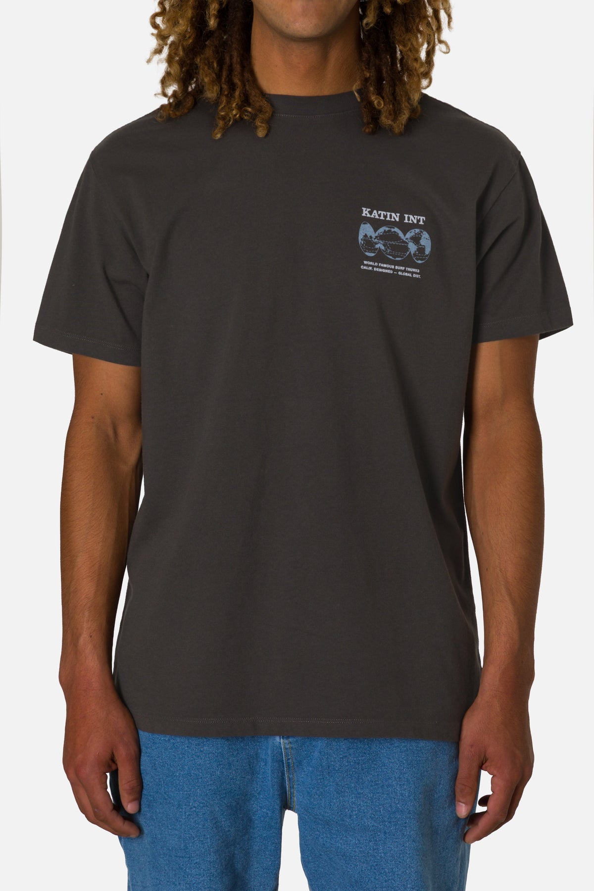 Person wearing a black t-shirt with a logo on a white background