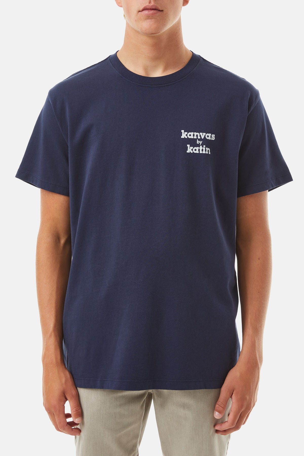 model wearing Polar navy shirt with White K-Man Graphic on a white background