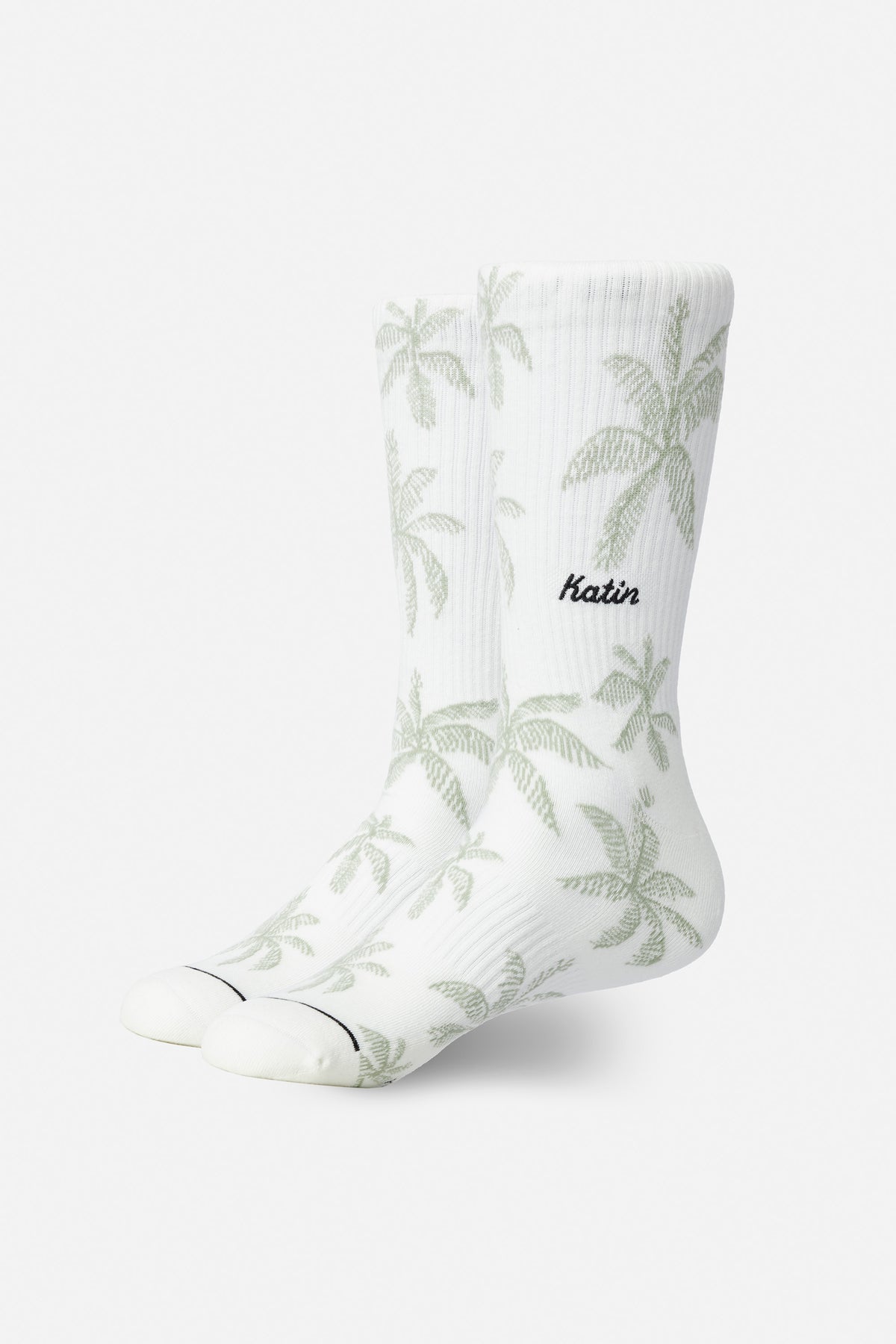 White socks with palm tree pattern and 'Katin' branding on a white background
