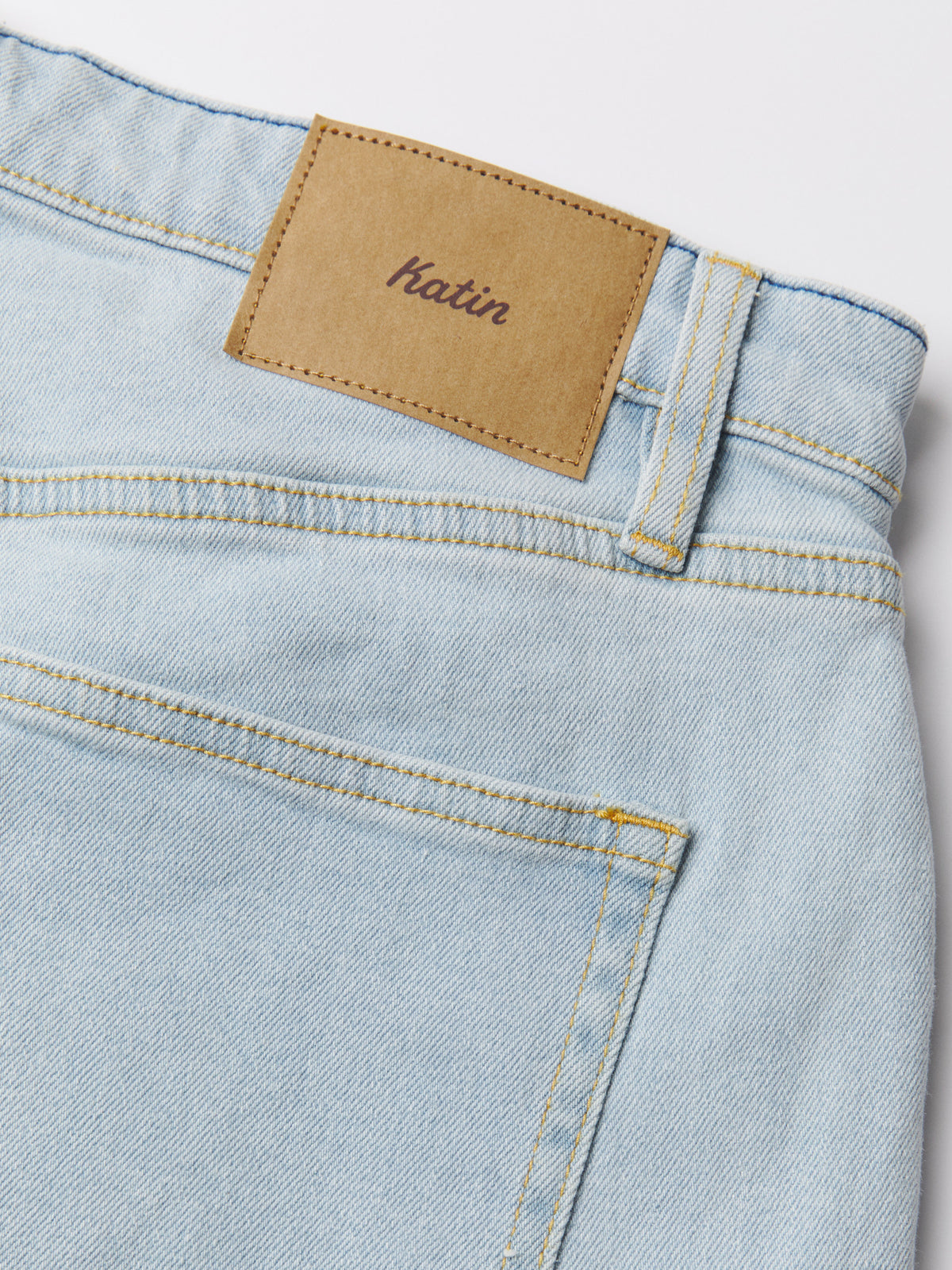 Katin George 64 Relaxed in Light Indigo denim, flat, leather Katin patch #color_light indigo