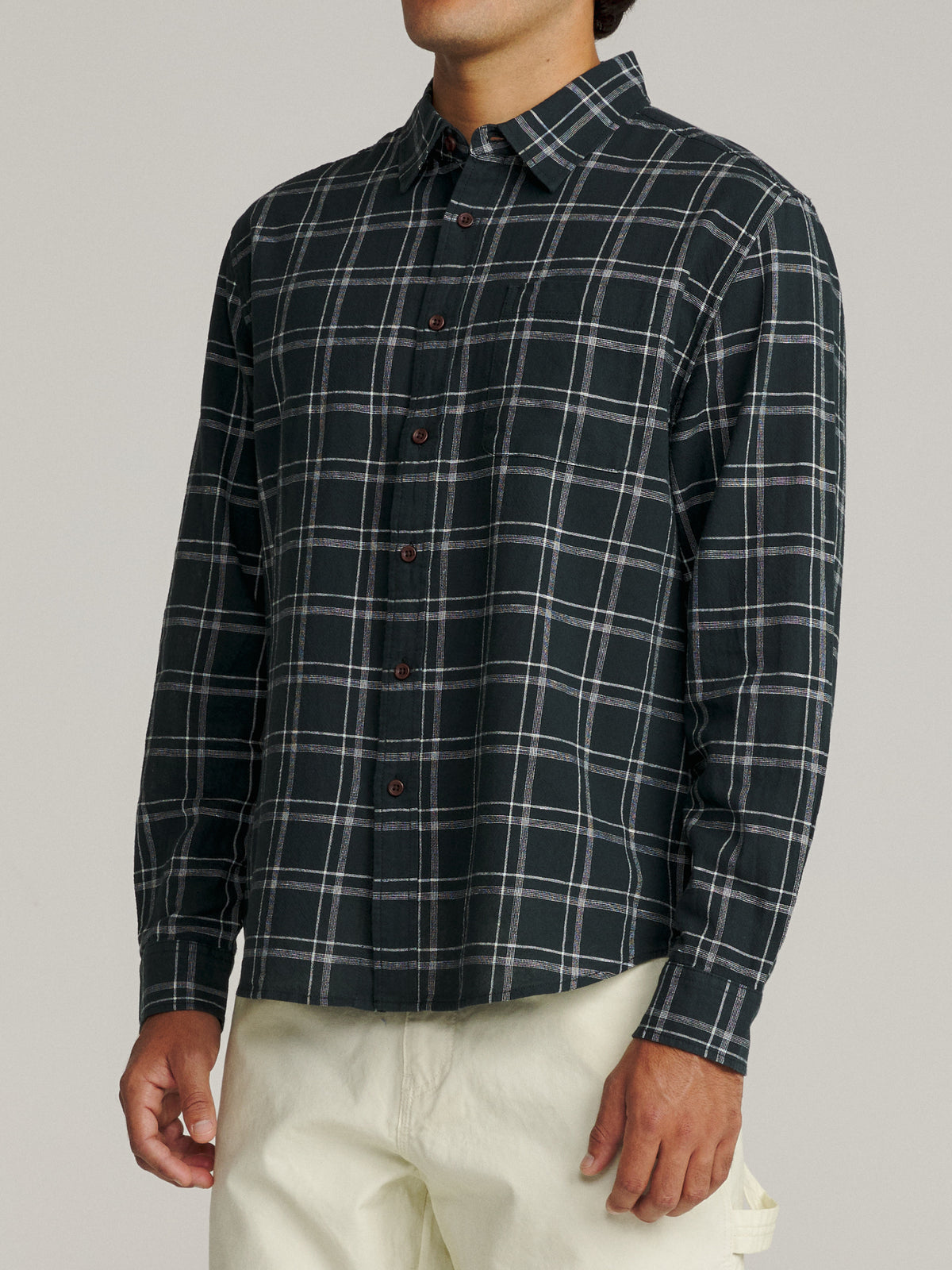 Katin Tack Shirt in Black with a simple two-color plaid, on model, side #color_black