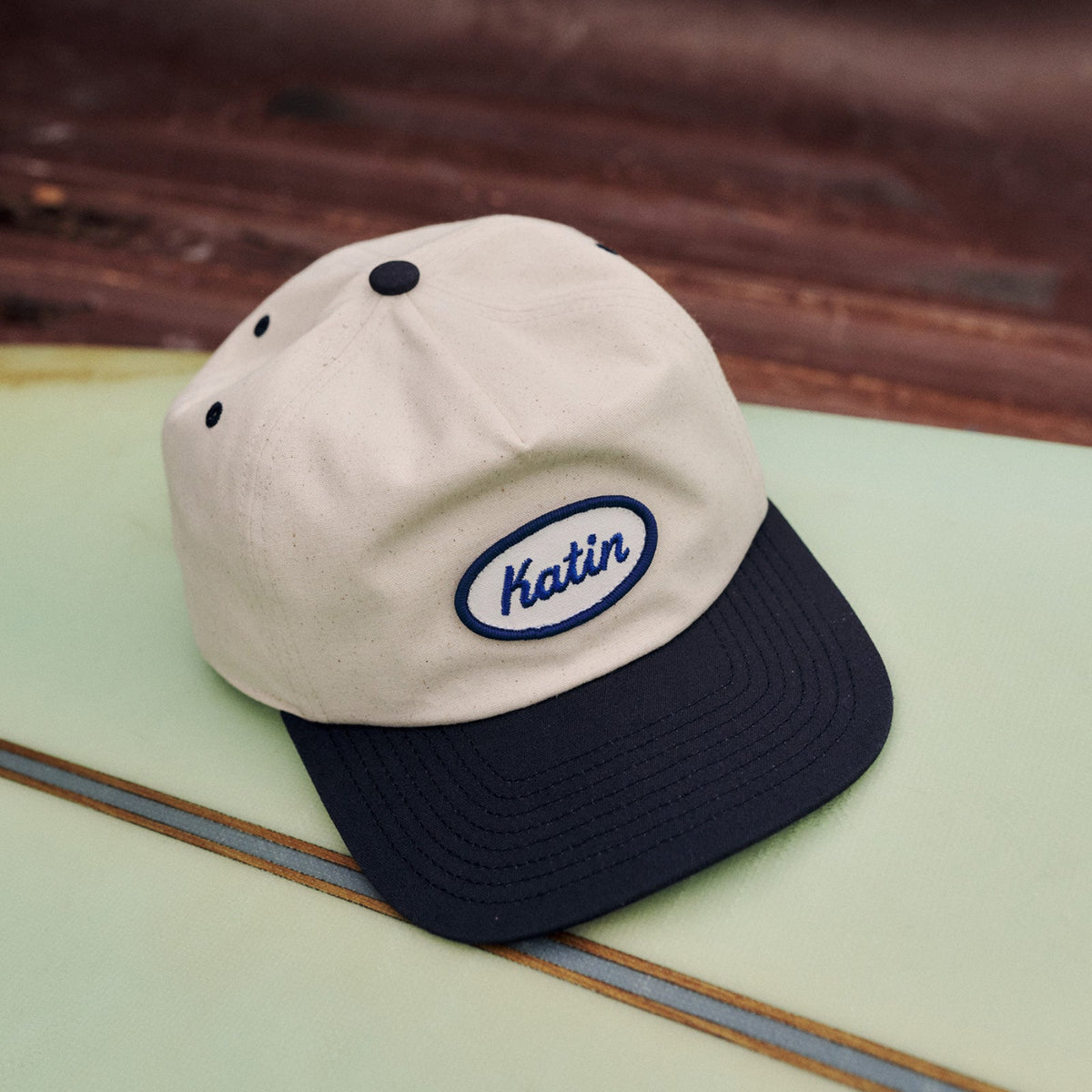 Katin hat on surfboard