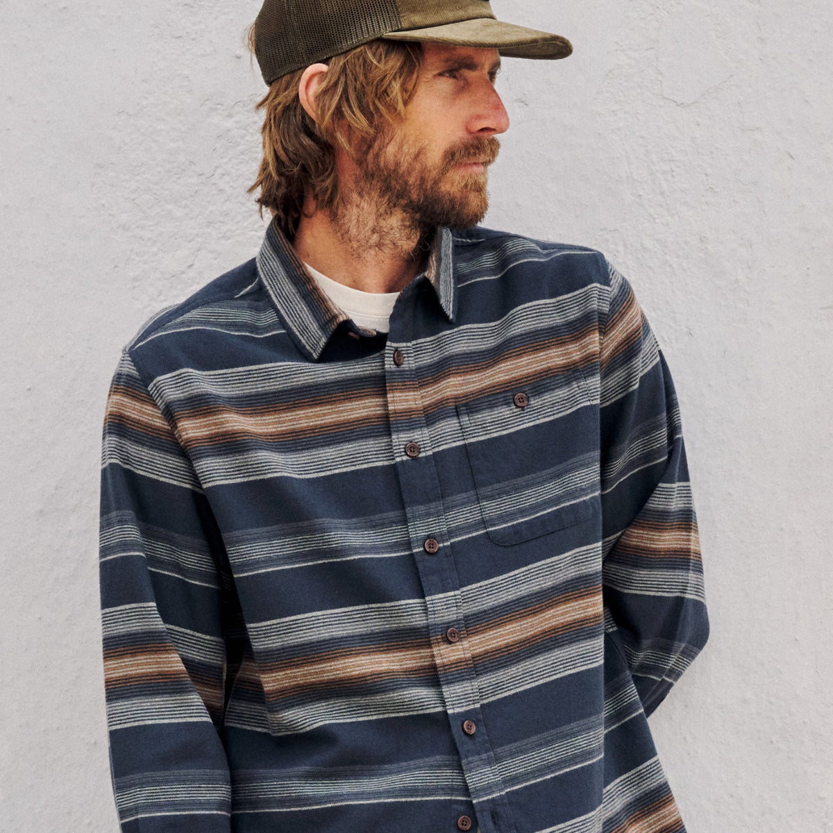 Man wearing a Katin long sleeve stripped flannel