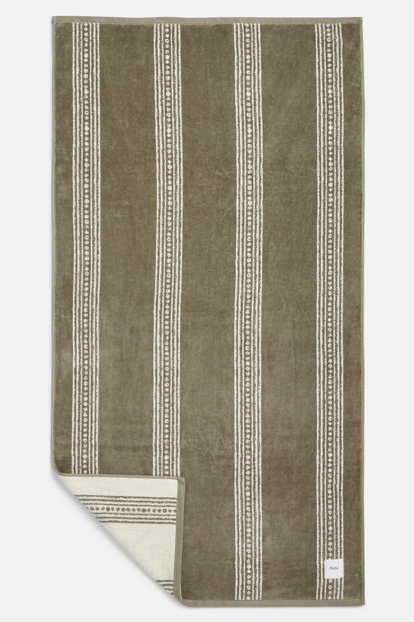 Brown/green color towel with white stripes on a white background