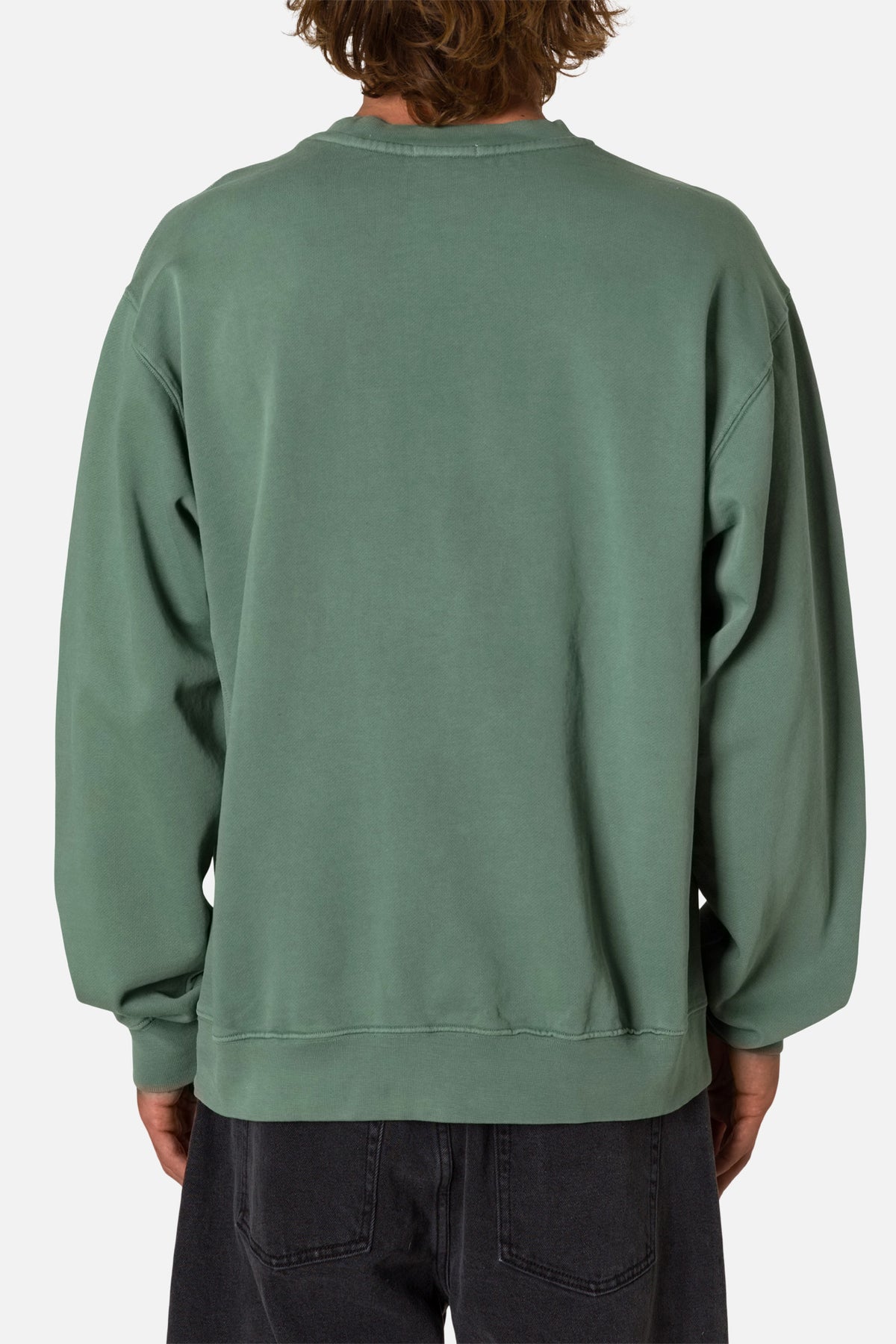 Back of person wearing a green sweatshirt  on a white background