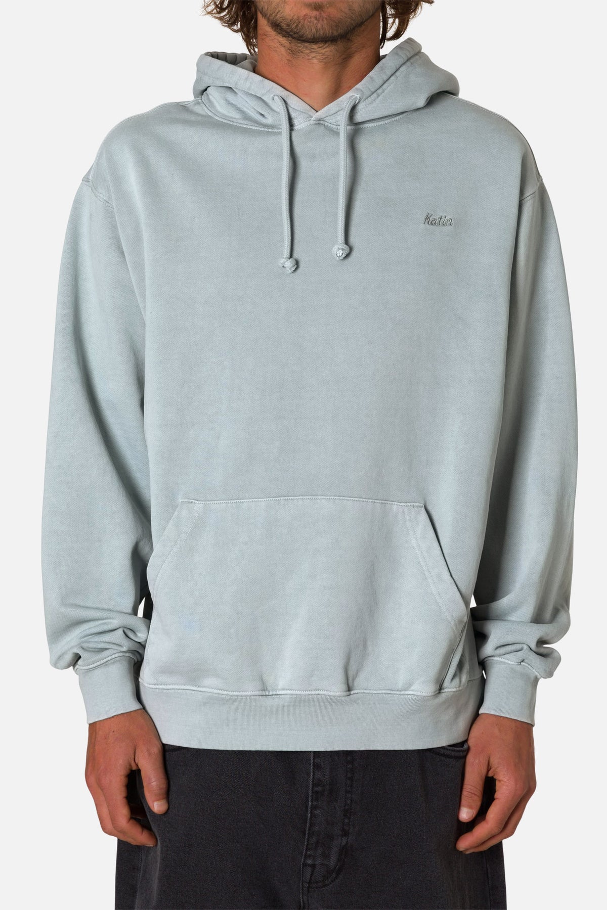 Light gray hoodie worn by a person on a white background