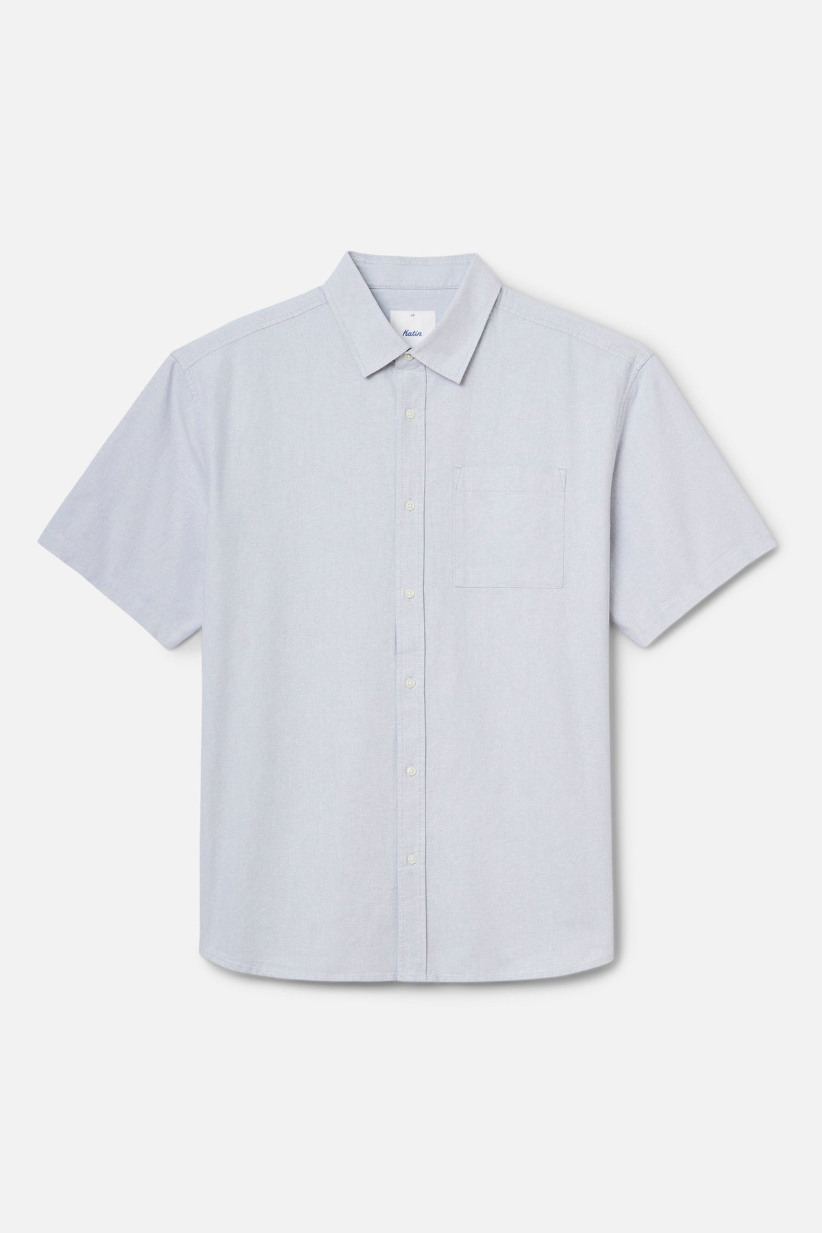Light blue short-sleeve shirt on a light gray background
