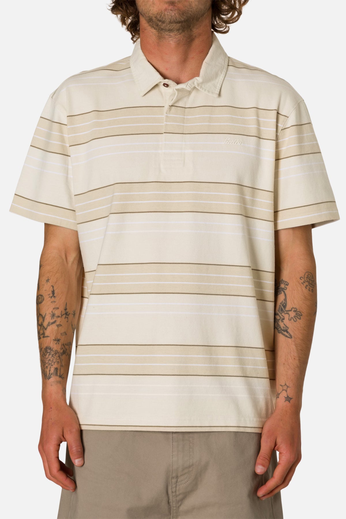 Man wearing a beige striped polo shirt on a white background