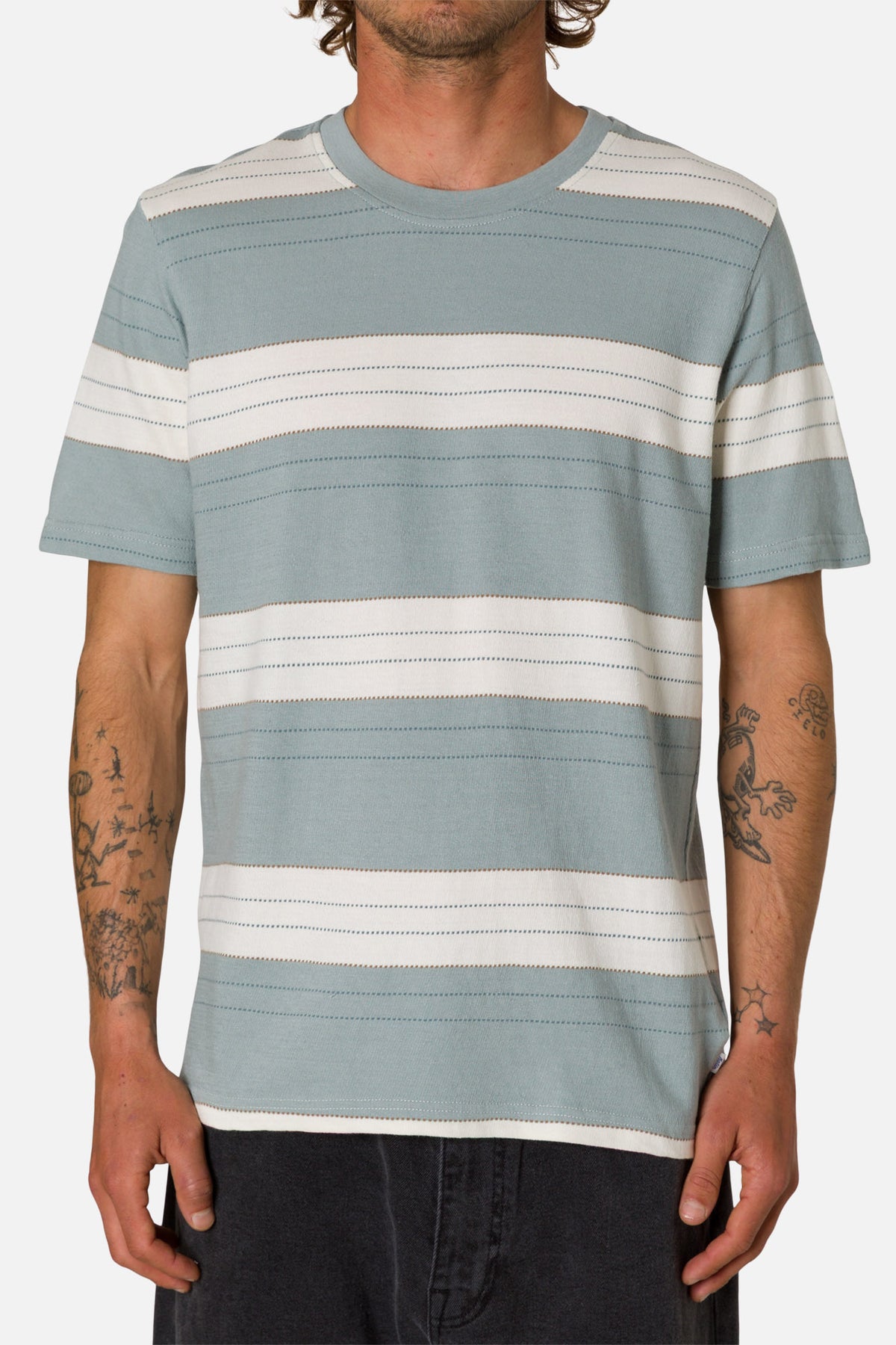 Man wearing a striped t-shirt with blue and white horizontal stripes on a plain background