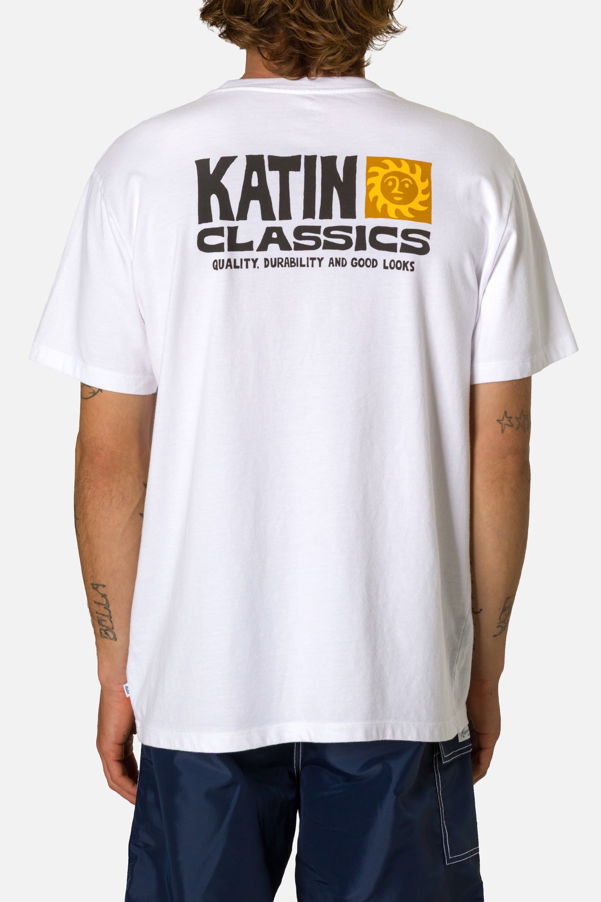 Person wearing a white t-shirt with 'Katin Classics' logo on the back.