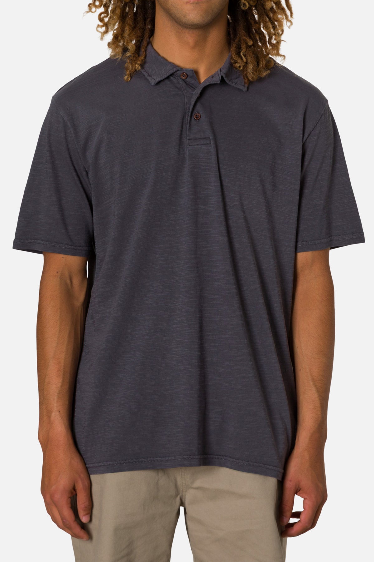 Man wearing a dark gray polo shirt on a white background