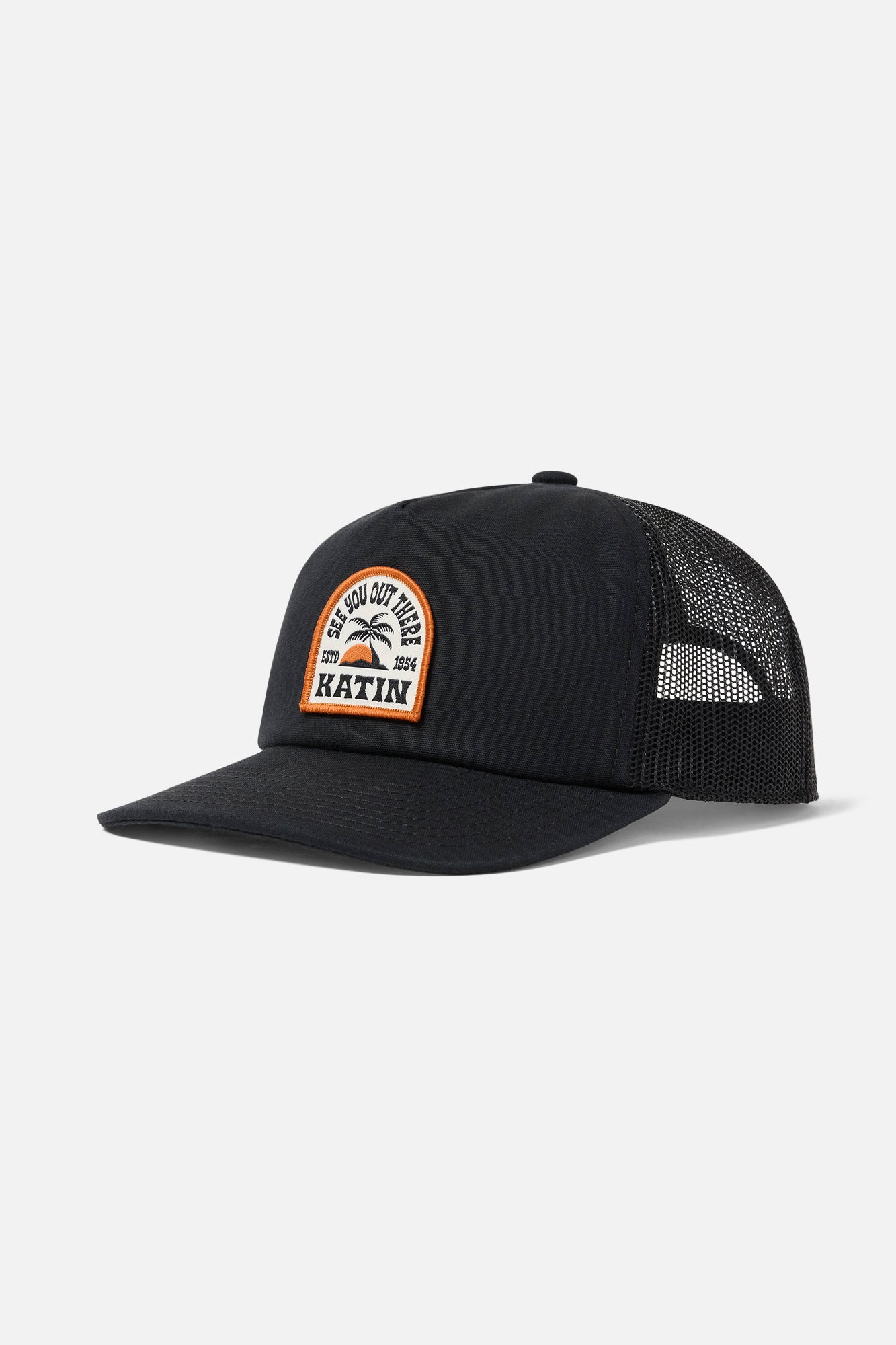 Black trucker cap with a patch on a white background featuring a island sunset with palm tree