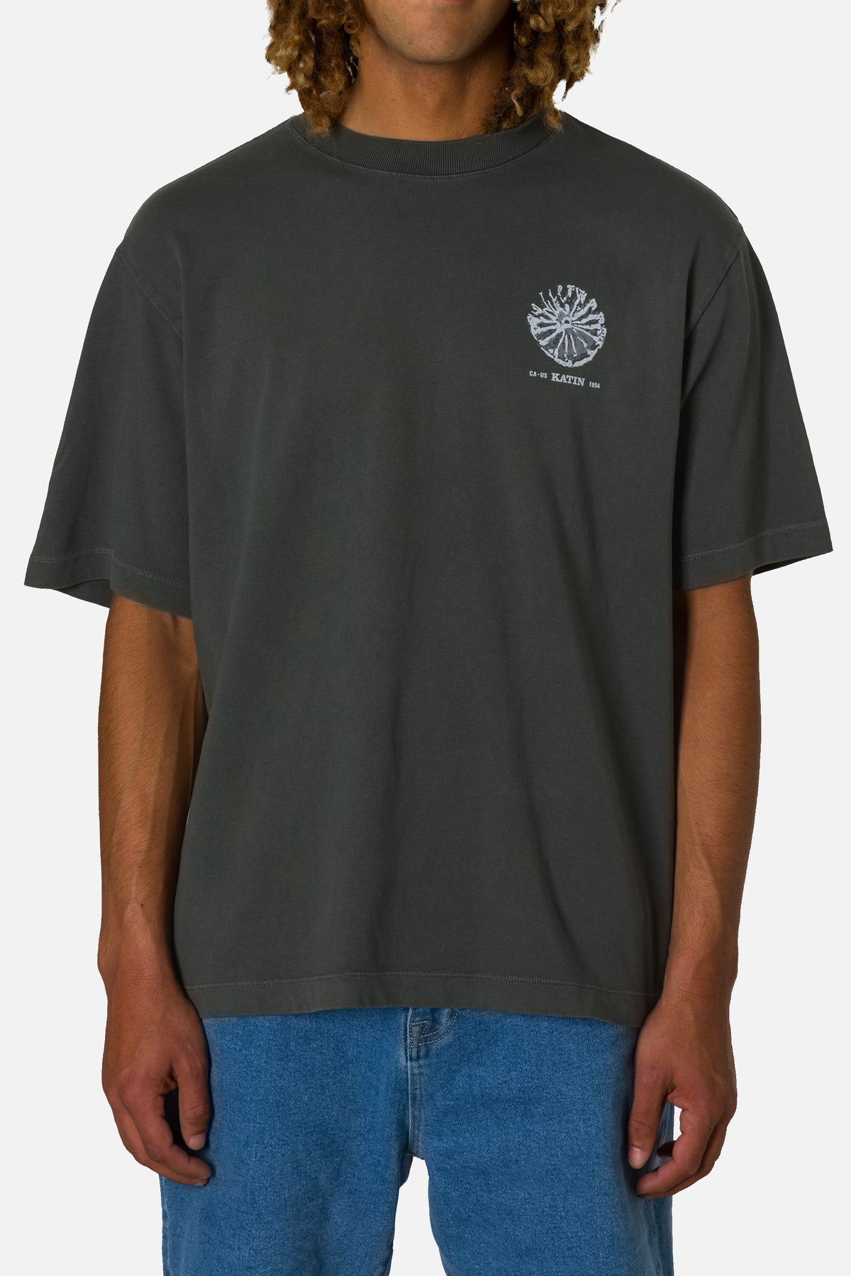 Person wearing a black t-shirt with a logo on a white background