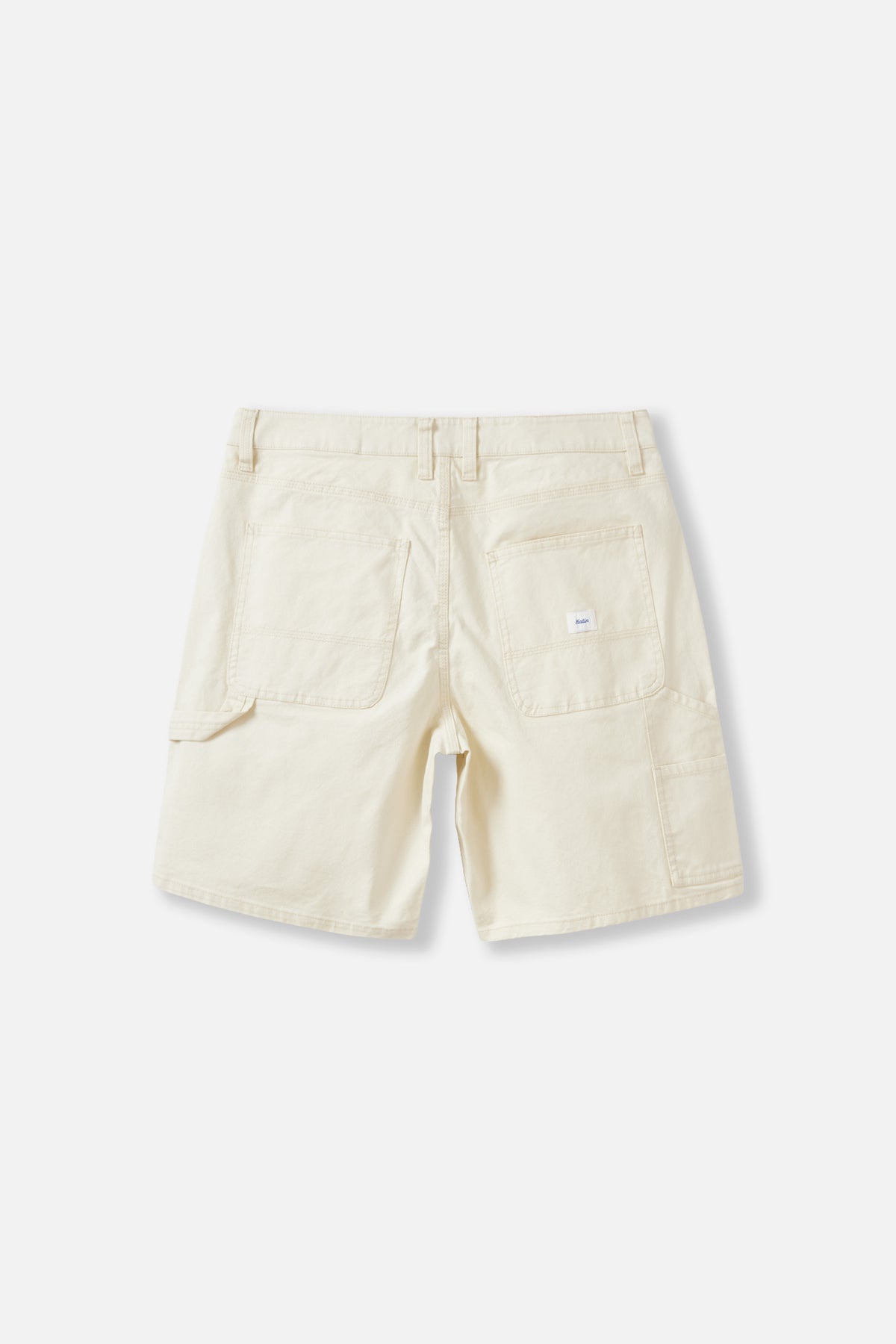 Back view of off white shorts on a white background