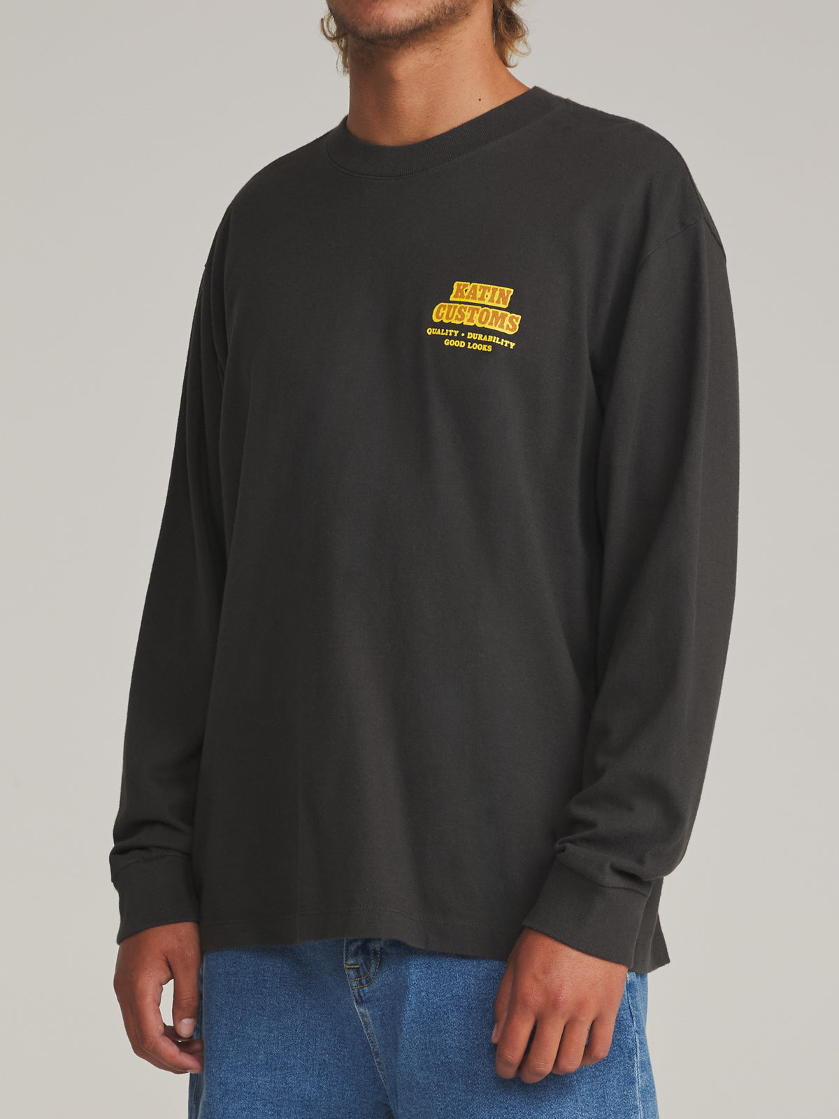 Katin Lorry Box Fit Ls Tee in Black Wash - worn on model, side