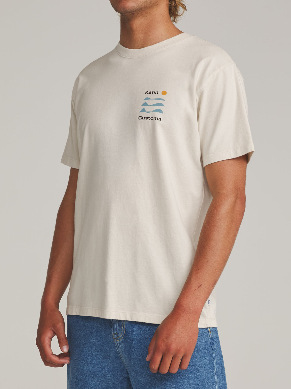 Katin Frequency Tee in Vintage White - worn on model, side