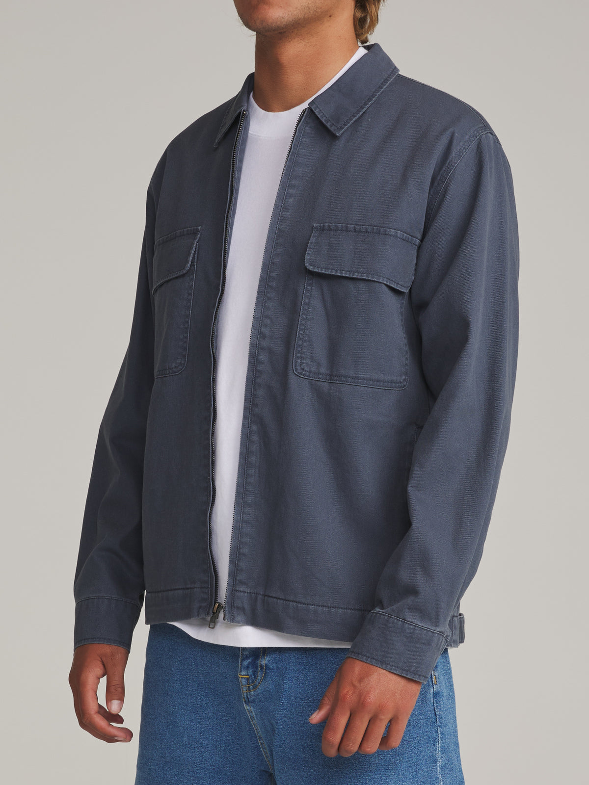 Katin Petrol Jacket in Washed Blue - worn on model, side