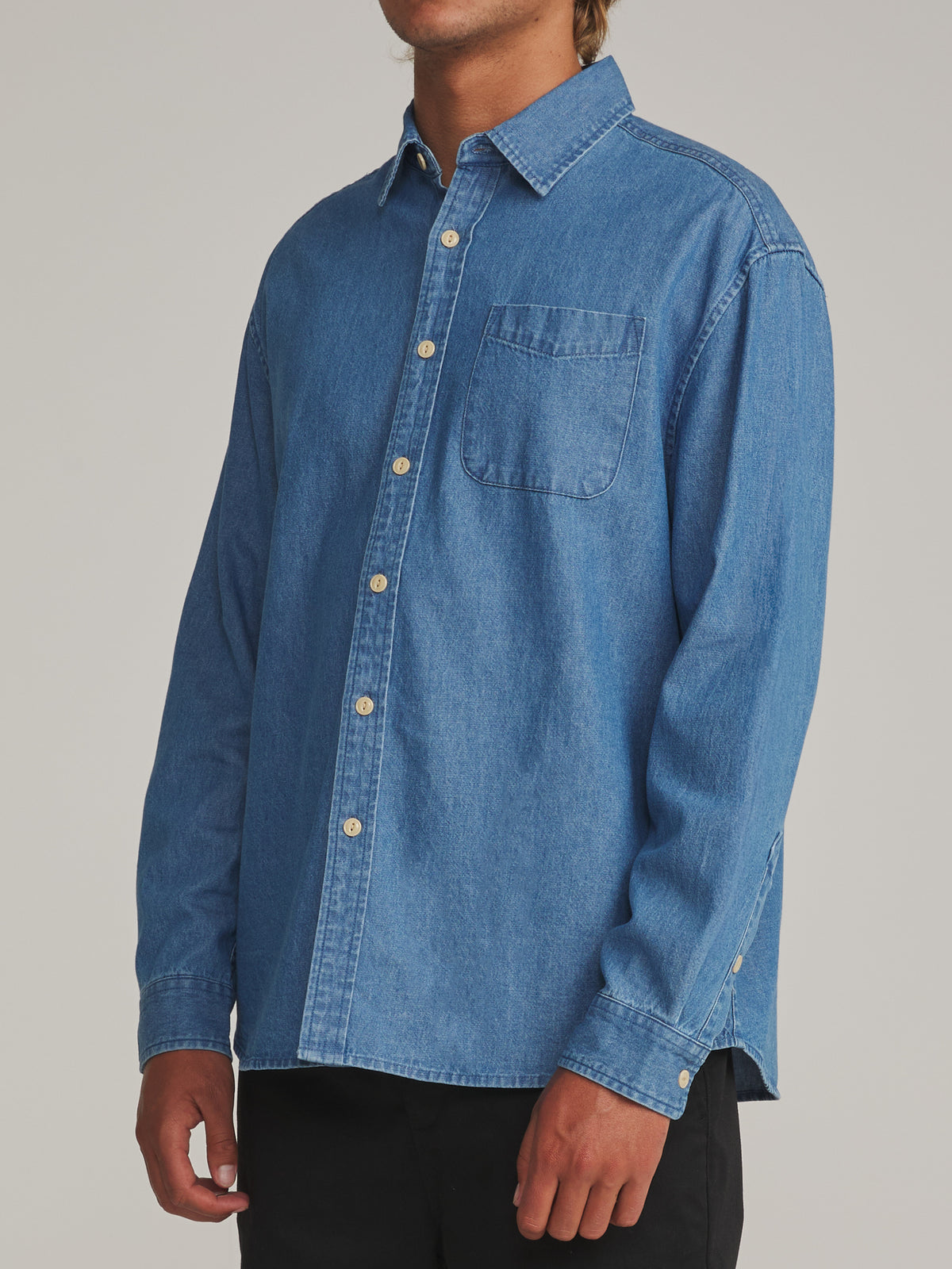 Katin Henry Denim Shirt in Medium Indigo - worn on model, side
