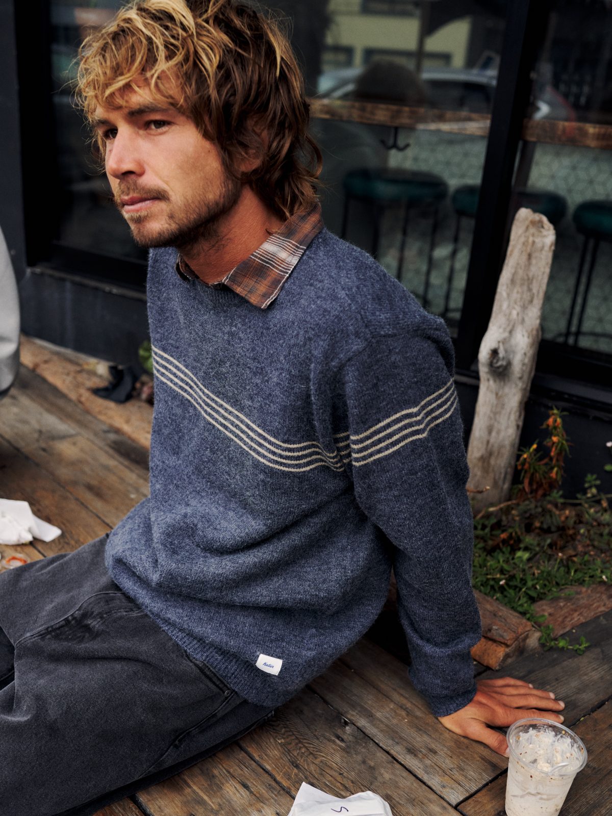 Katin Charles Sweater in Navy with cream chest stripes, worn over a plaid shirt, lifestyle #color_navy