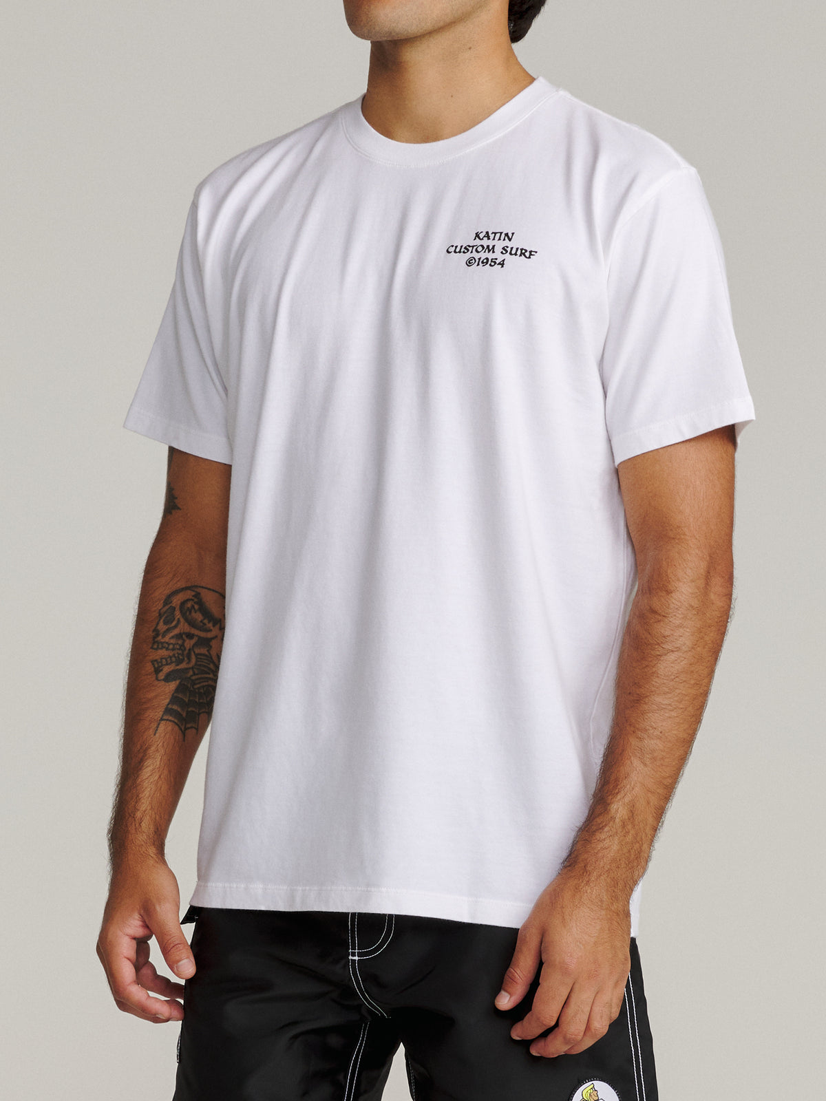 Katin Spell Tee in White midweight jersey, on model, side #color_white