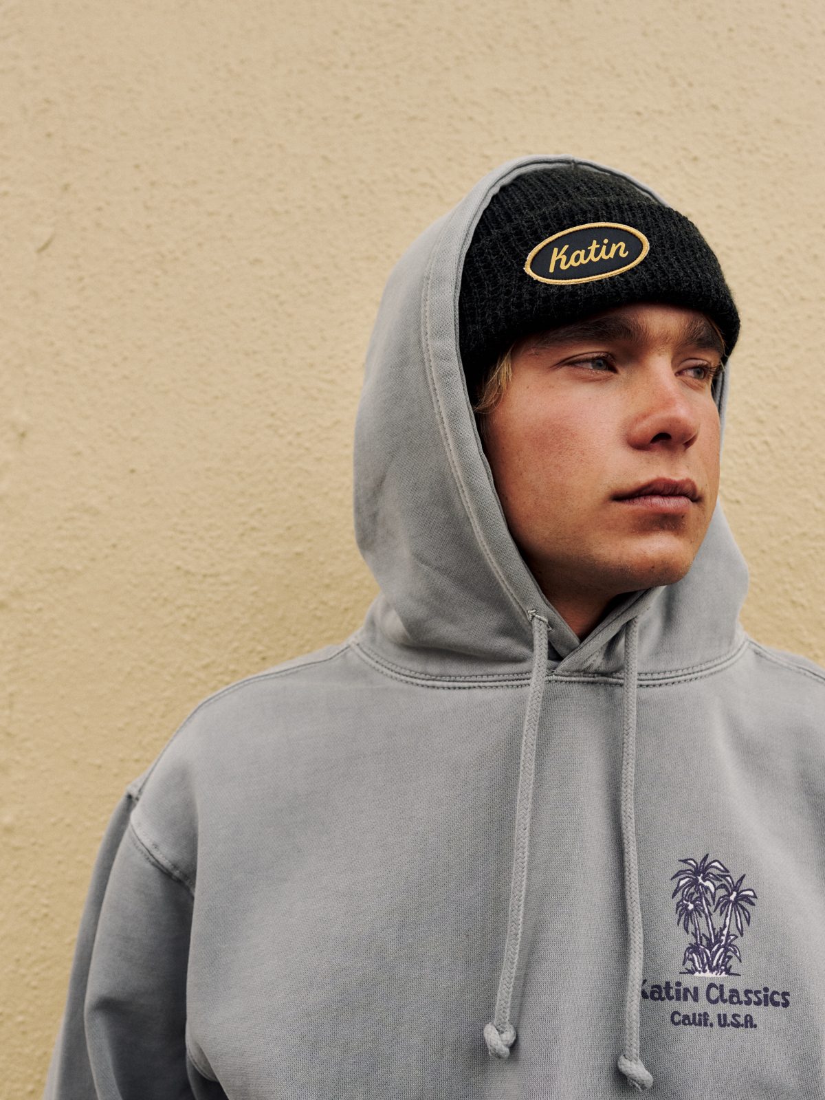 Katin Roadside Beanie in Graphite, waffle-knit cuff beanie with an oval Katin patch, on model, lifestyle #color_graphite