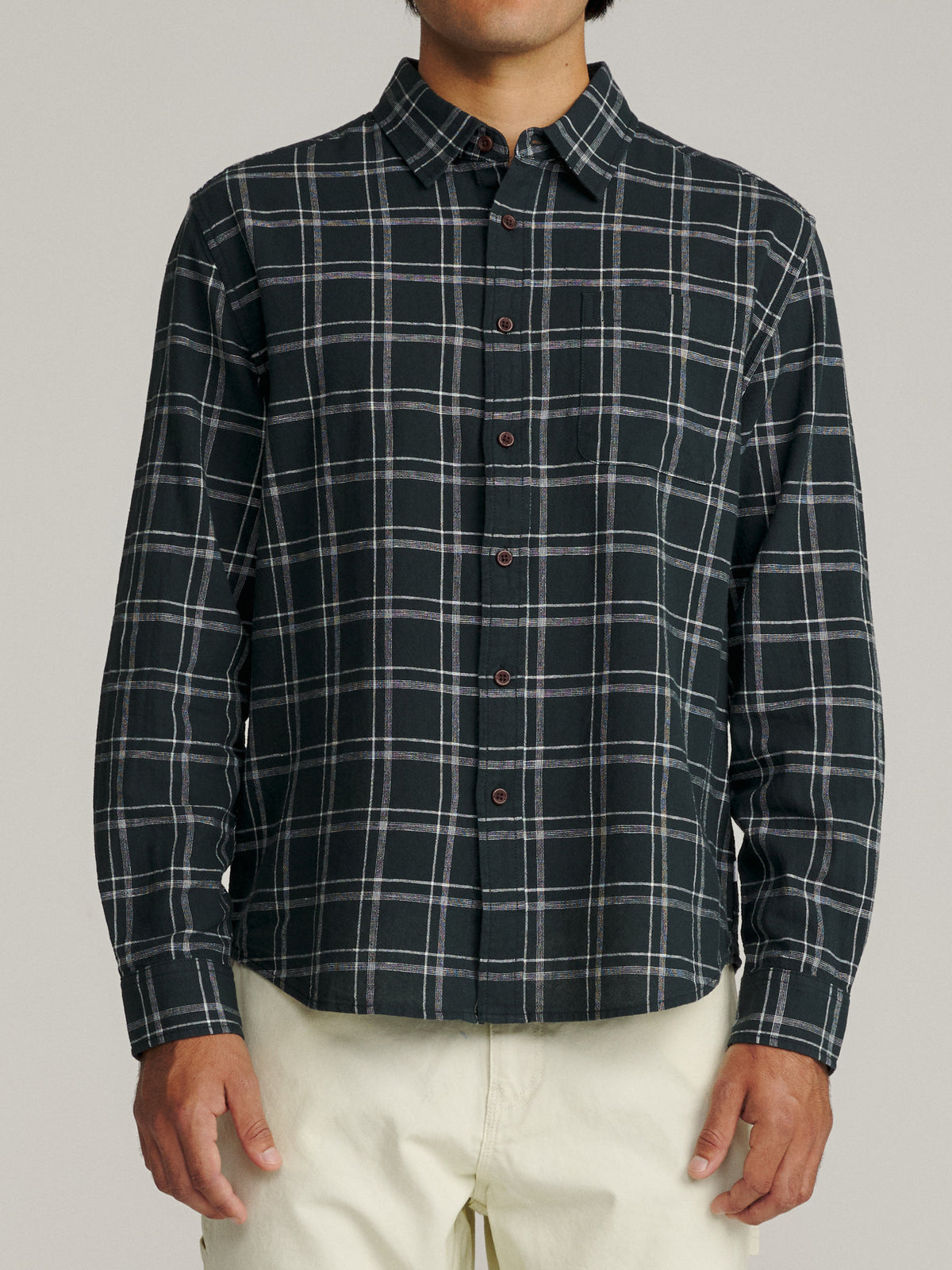 Katin Tack Shirt in Black with a simple two-color plaid, on model, front #color_black