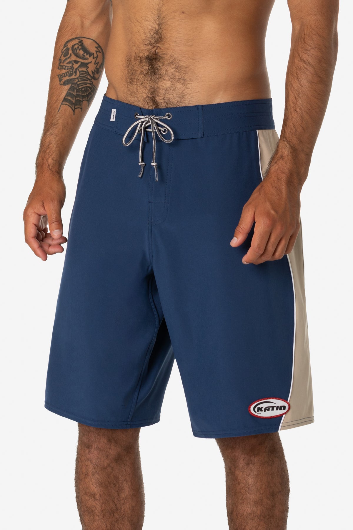 Katin Flow Surf Trunk in Navy, on model, side #color_navy